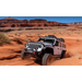 Jeep Wrangler driving through desert - AMP Research PowerStep XL Black