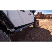 AMP Research PowerStep XL installed on a Jeep JT Gladiator parked on dirt road