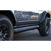 Black truck with tire cover - AMP Research Ford Bronco XL PowerStep