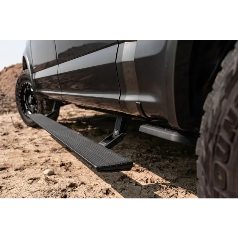 Close up of AMP Research PowerStep Xtreme Black on Ford Bronco with tire tread pattern.