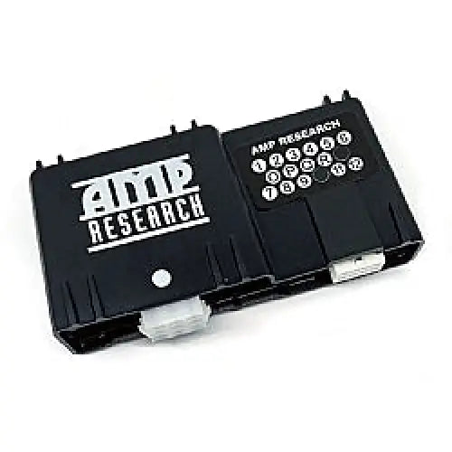 Close up of black and white electronic device with keypad from AMP Research B05 to STB Pigtail End.