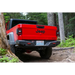 Red Jeep parked in wooded area near tree - ARB 20-21 Jeep Gladiator JT Rear Bumper.