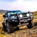 Blue Jeep parked in field - ARB Ford Bronco Under Vehicle Protection offering transfer case protection.