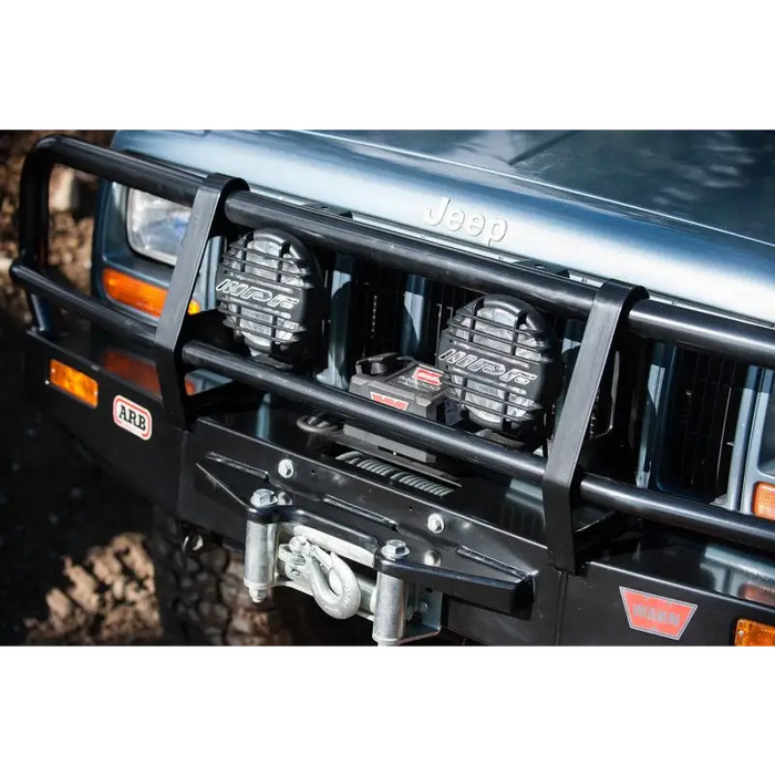 ARB 6in 55W driving kit front bumper mount close up.