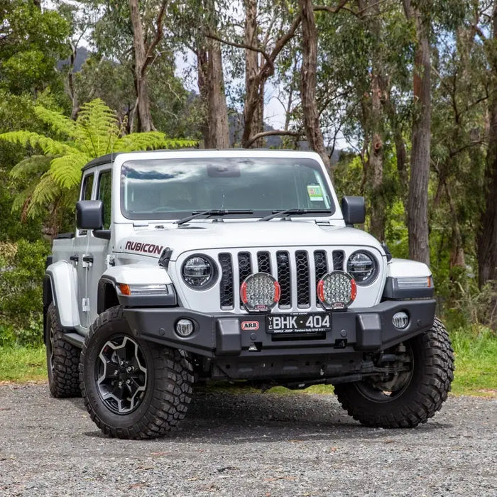 Jeep Wrangler parked in the middle of a forest