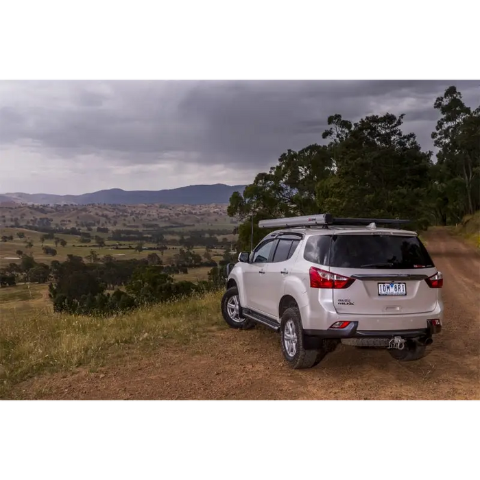 ARB Aluminum Awning Kit with Light 8.2ft x 8.2ft parked on dirt road overlooking valley