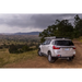 ARB Aluminum Awning Kit with Light 8.2ft x 8.2ft parked on dirt road overlooking valley