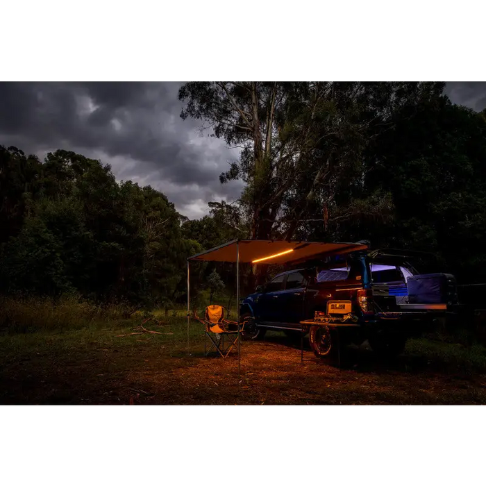 Truck parked in dark with tent on top - ARB awning kit w/ light installed