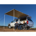 Man sitting in truck under arb awning kit tent