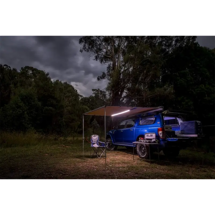 ARB Awning Light LED Strip on Blue Van in Woods at Night