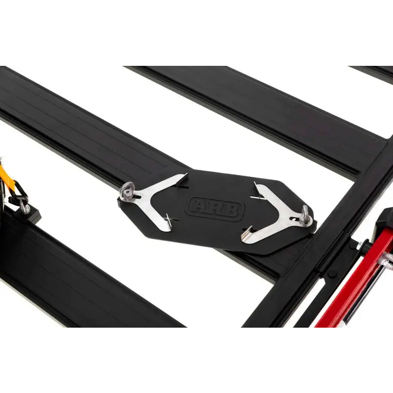 Side view of ARB BASE Rack Gas Bottle Holder folding table with dovetail extrusion for Jeep Wrangler.