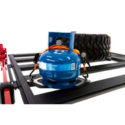 ARB BASE Rack Gas Bottle Holder with blue gas tank and red hose atop, suitable for Jeep Wrangler.