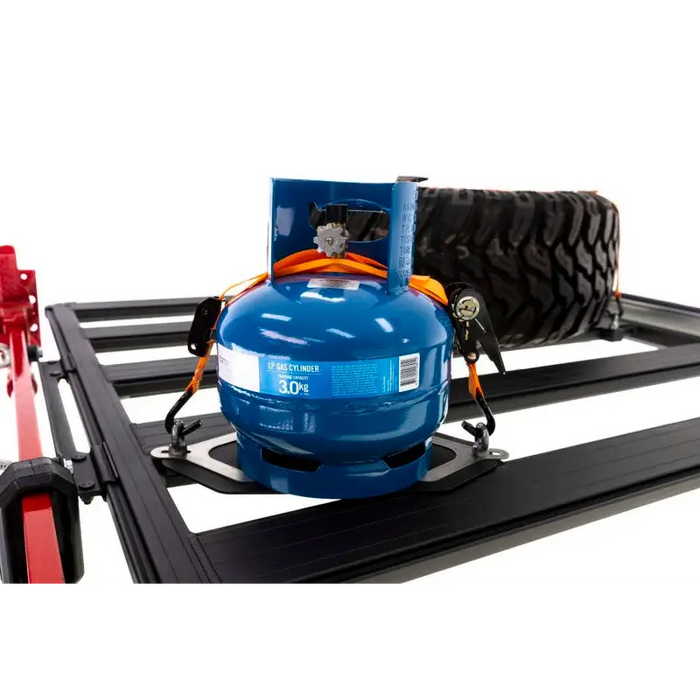 ARB BASE Rack Gas Bottle Holder with blue gas tank and red hose atop, suitable for Jeep Wrangler.