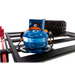 ARB BASE Rack Gas Bottle Holder with blue gas tank and red hose atop, suitable for Jeep Wrangler.