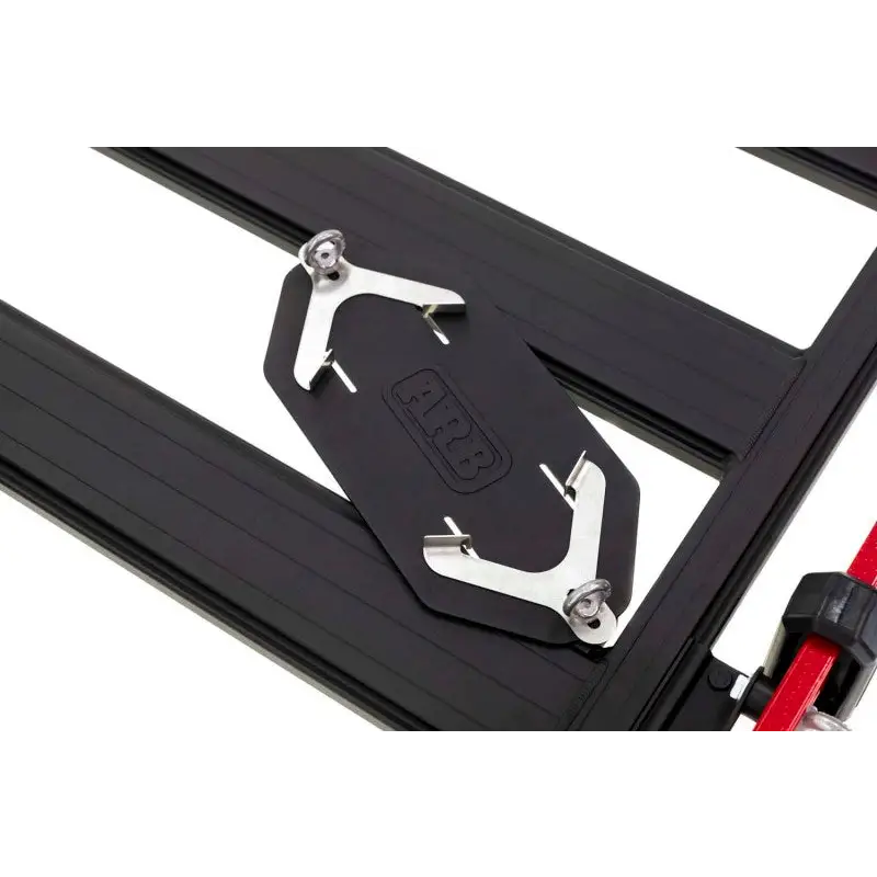 Open sliding door and latch on ARB BASE Rack Gas Bottle Holder for Jeep Wrangler.