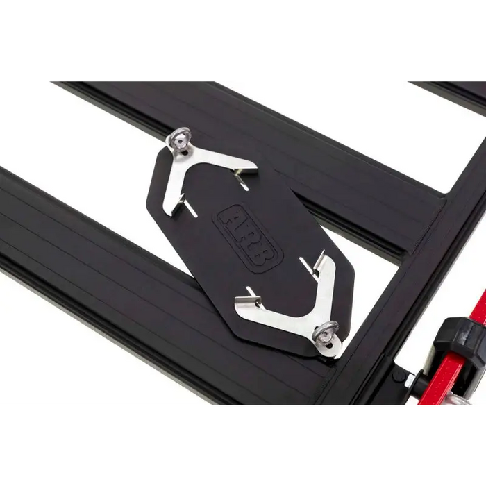 Open sliding door and latch on ARB BASE Rack Gas Bottle Holder for Jeep Wrangler.