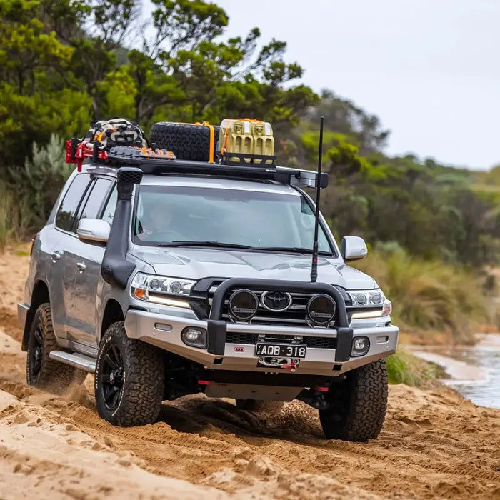 Truck driving down muddy road with arb base rack mount kit - for 1770040.