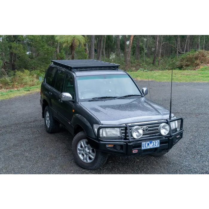 Black toyota paa with black roof rack displayed on arb base rack mount kit - base rack specific.