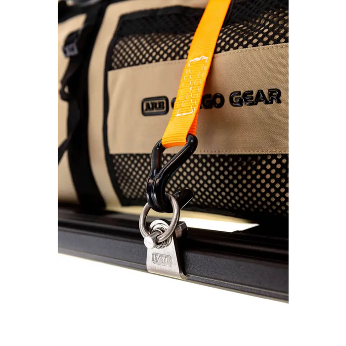 Close up of luggage tag on ARB Baserack Tie Down.