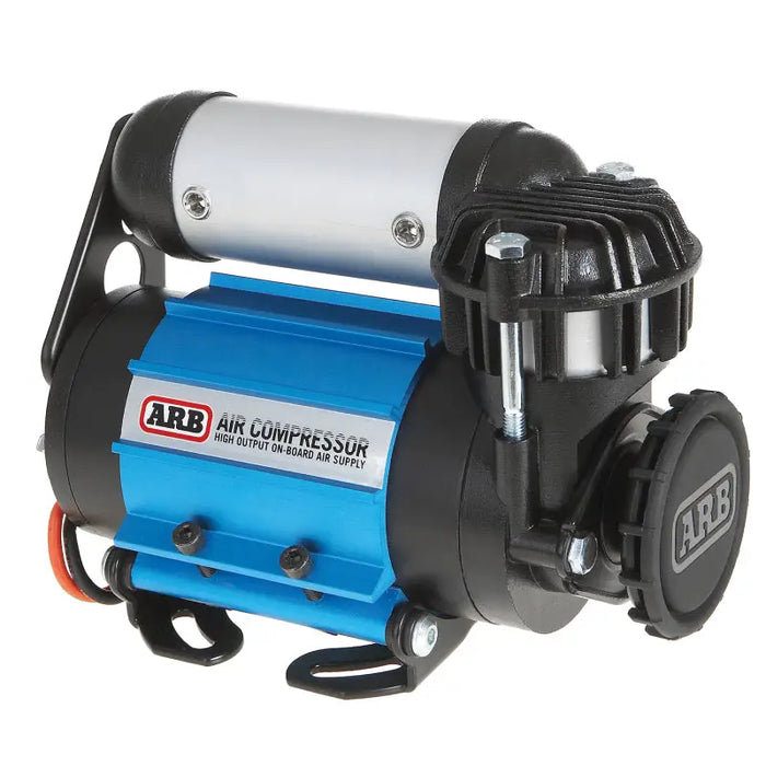 Close up of blue ARB air compressor on white background