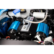 ARB Compressor Twin 12V with blue car engine and white/black cover