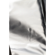 Silver foil sheet displayed in ARB Cooler Bag Charcoal w/ Red Highlights, holds 22 cans