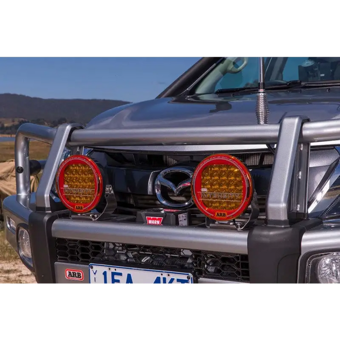 ARB Cover Amber Ar32 with silver truck showcasing red lights for Jeep Wrangler.