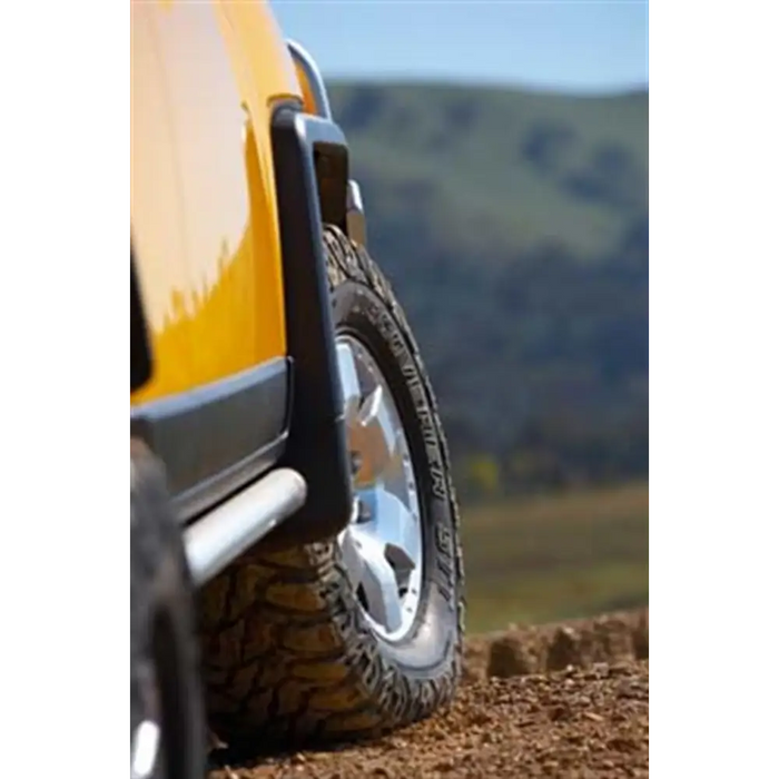 ARB Deluxe Rock Rails on Yellow Jeep with Tire