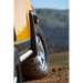 ARB Deluxe Rock Rails on Yellow Jeep with Tire