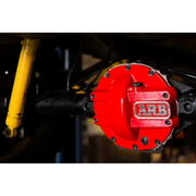 Red brake cover on yellow motorcycle - ARB Diff Cover Chrysler 8.25In helps protect against road hazards.