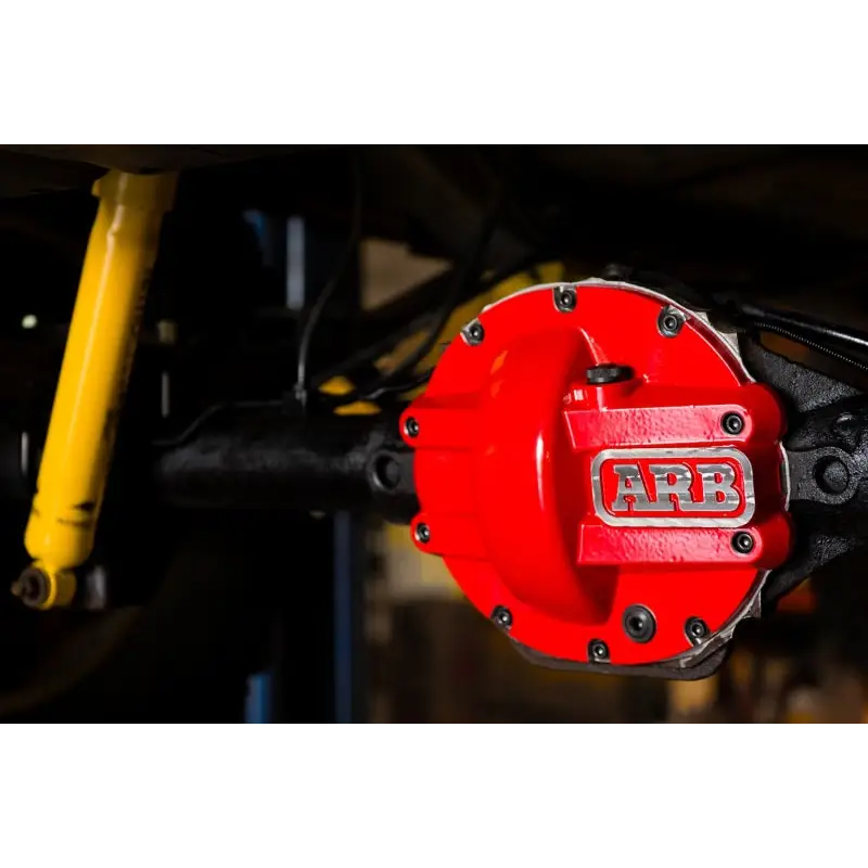 Red brake cover on yellow motorcycle - ARB Diff Cover Chrysler 8.25In helps protect against road hazards.