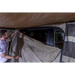 Man setting up tent on ARB Dlxe Awn Room W/Flr 2.0M79Lg 2000X2500mm