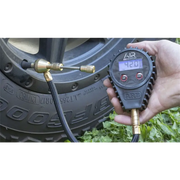 ARB E-Z Deflator Digital Gauge - Hand holding tire pressure gauge