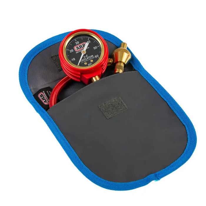 ARB E-Z Deflator Kit Psi Gauge in red and blue case holds a watch