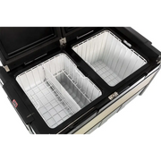 Black and white stove with two pans next to ARB Fridge 101 Quart DZ Zero B Plug