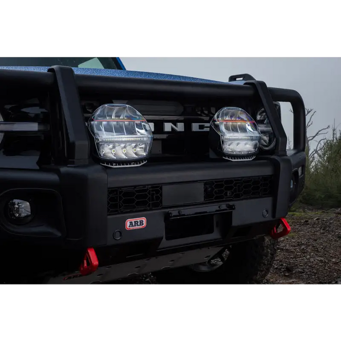 Close up of truck with black bumper and lights, showcasing ARB Intensity IQ driving lights.