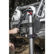 Man holding wren by silver ARB Jack - hydraulic technology for farm jacks