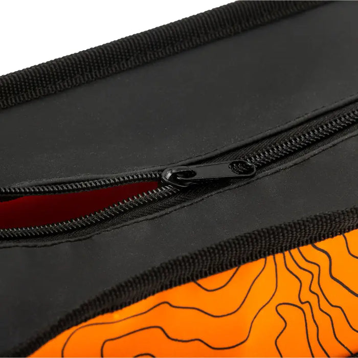 Orange and black topographic ARB Micro Recovery Bag features zipper pouch for carrying items.