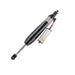 Black and white pen with pink tip on ARB OME BP51 shock absorber.