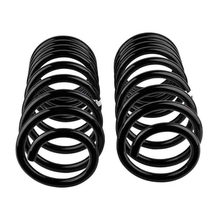 Arb / ome coil spring rear 100 ifs hd - a set of black rubber springs for a car