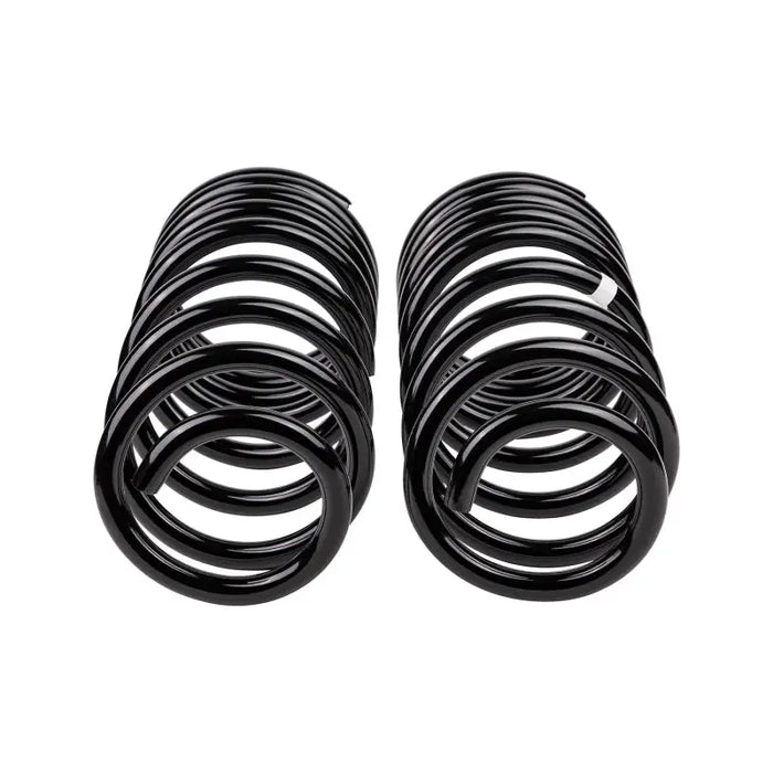 Black rubber springs for a car - arb / ome coil spring rear lc 200 ser