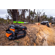 ARB Premium Recovery Kit S2 featuring a black and orange snatch strap bag on dirt road.