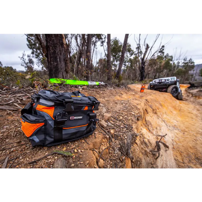 ARB Premium Recovery Kit S2 featuring a black and orange snatch strap bag on dirt road.