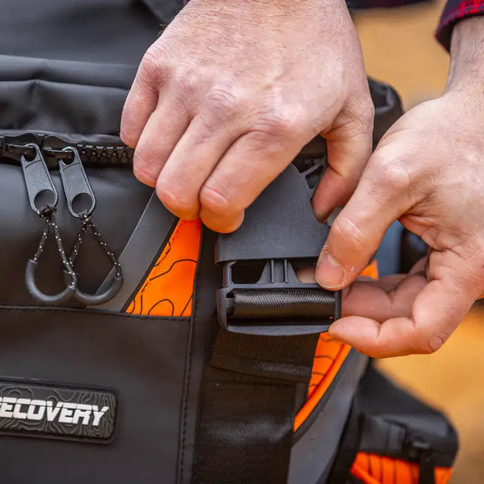 ARB Premium Recovery Kit S2 featuring a man holding a black and orange bag.