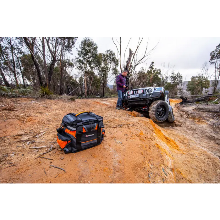 ARB Premium Recovery Kit S2 featuring man using chainsaw to remove tree.