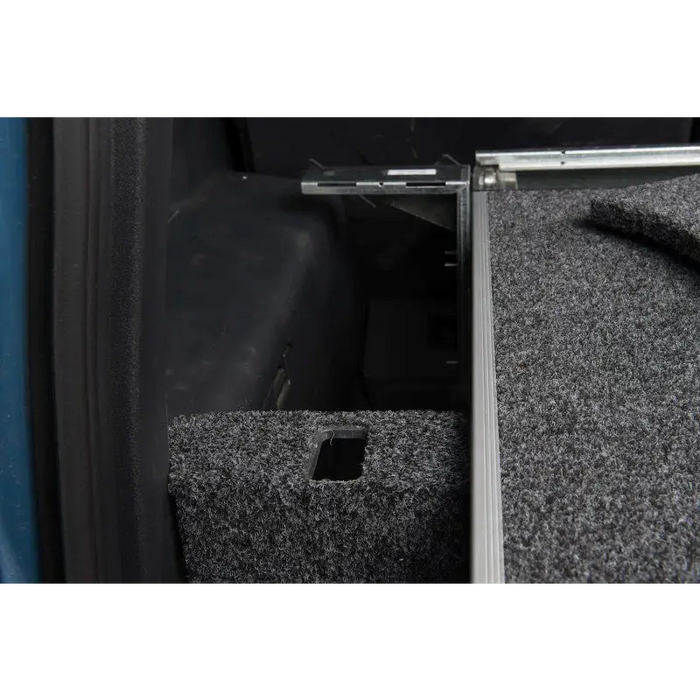 Close up of car seat and box in ARB R/Drw Side Floor Kit Fj Cruiser