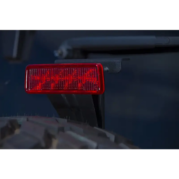 Red tail light on a Jeep Wrangler rear bar.