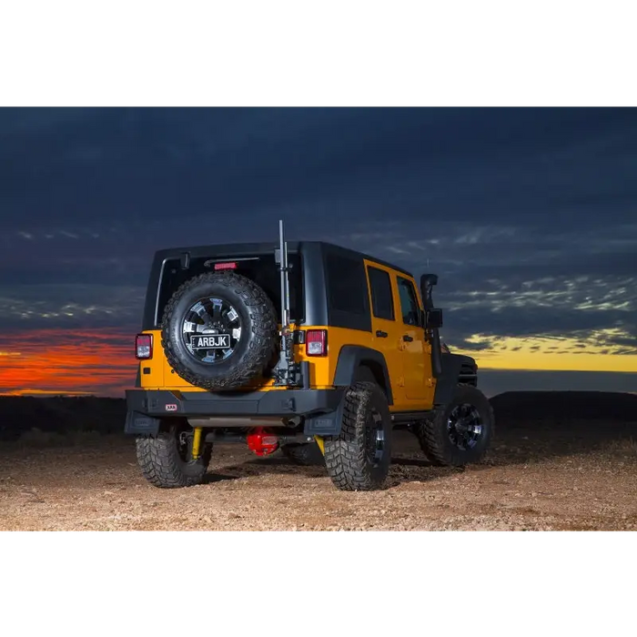 Black textured ARB rear bar JK Jeep parked in desert at night.