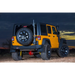 Jeep Wrangler parked in desert at night.