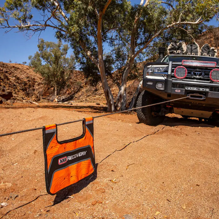 ARB Recovery Damper with mounted radio on truck roof for Jeep Wrangler and Ford Bronco.